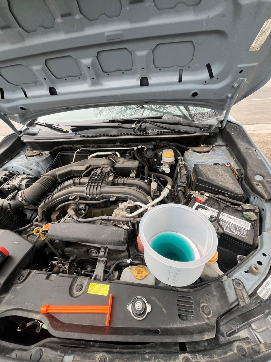 Subaru engine bay during an oil change
